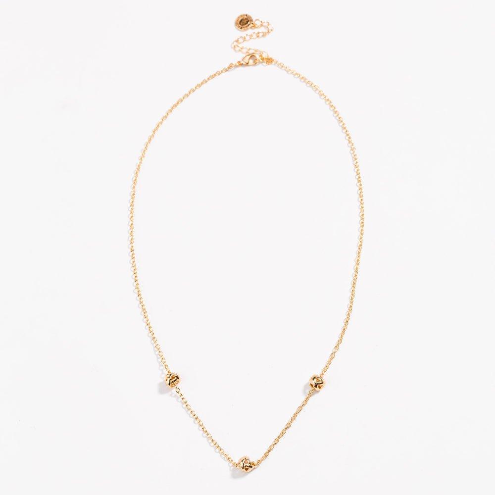 Gold-tone oval necklace with love-knot charms at the ends