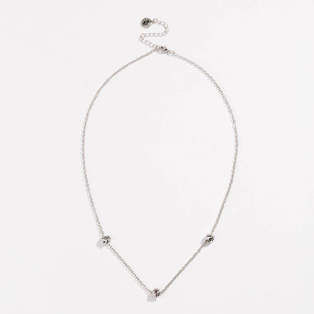 Silver-tone oval necklace with love-knot charms at the ends