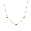 Gold-tone chain necklace with small love-knot pendant at the center