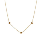 Gold-tone chain necklace with small love-knot pendant at the center