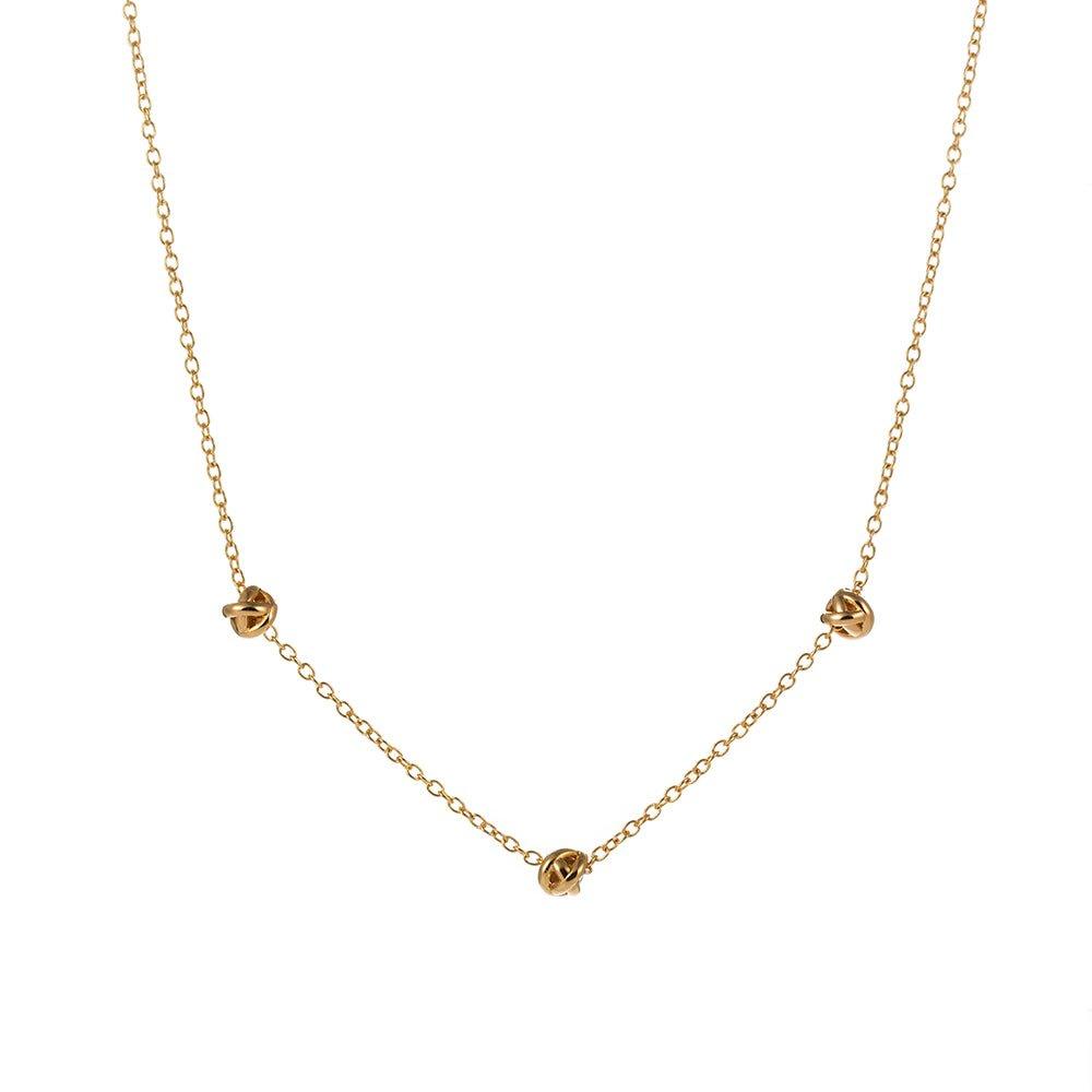 Gold-tone chain necklace with small love-knot pendant at the center