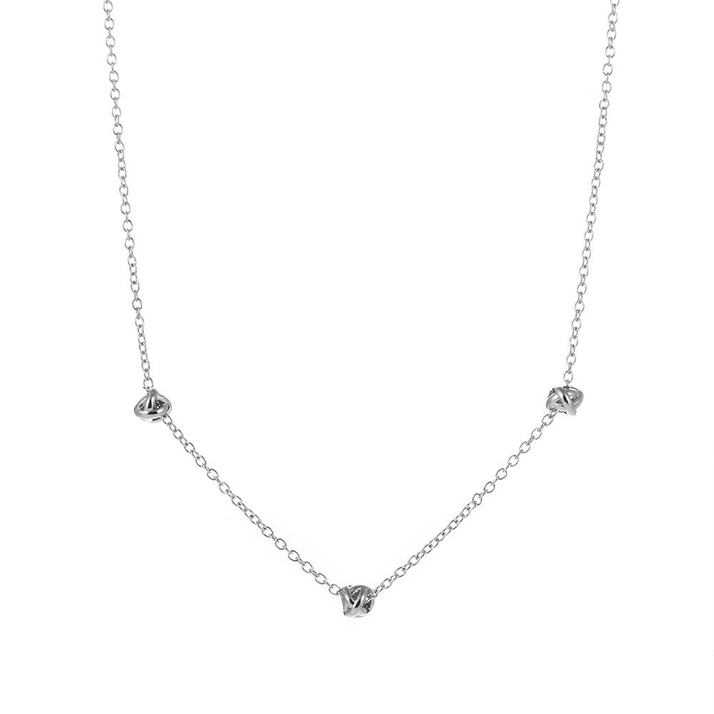 Silver-tone chain necklace with small love-knot pendant at the center