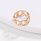 Gold love-knot chain ring, interlocking sculpted link band