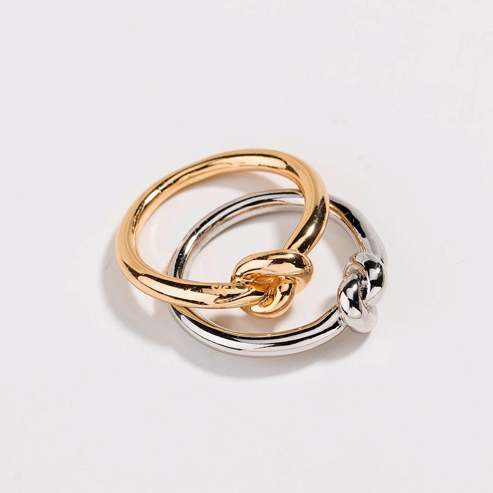 Two-tone love knot commitment ring, interwoven gold and silver polished bands
