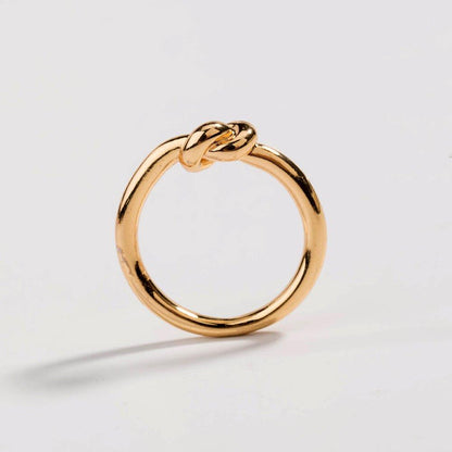 Gold love knot commitment ring, round band with sculpted knot detail