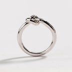 Silver love knot commitment ring, round band with sculpted knot detail