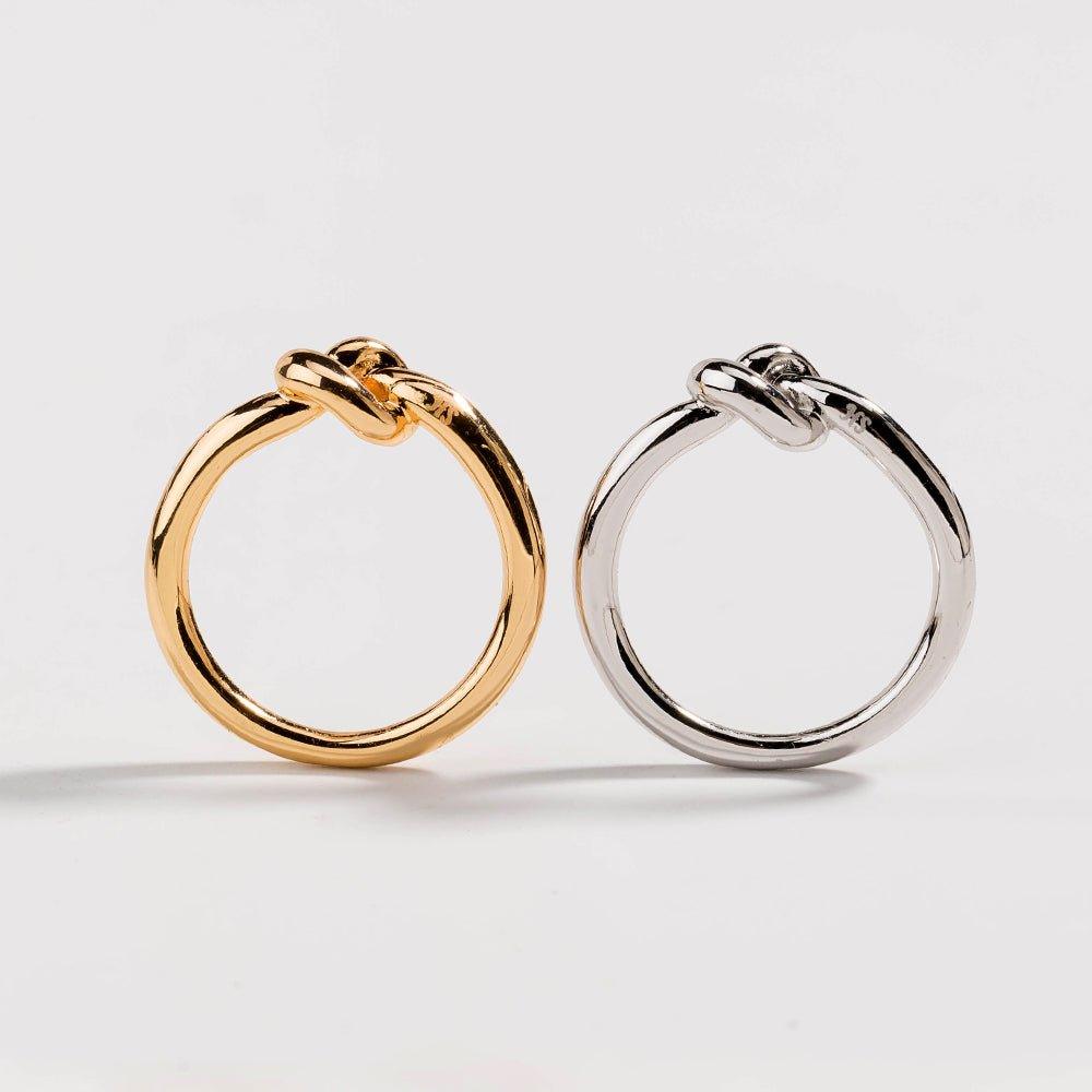 Set of love knot commitment rings, one gold tone and one silver tone