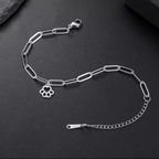 Silver link bracelet with paw-print charm, chain links, and clasp detail