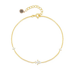 Gold delicate chain bracelet with tiny CZ stones and round logo charm