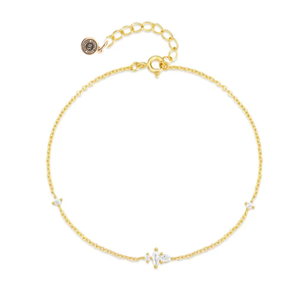 Gold delicate chain bracelet with tiny CZ stones and round logo charm