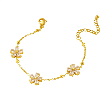 Gold-tone crystal blossom bracelet with five flower-shaped charms and link chain