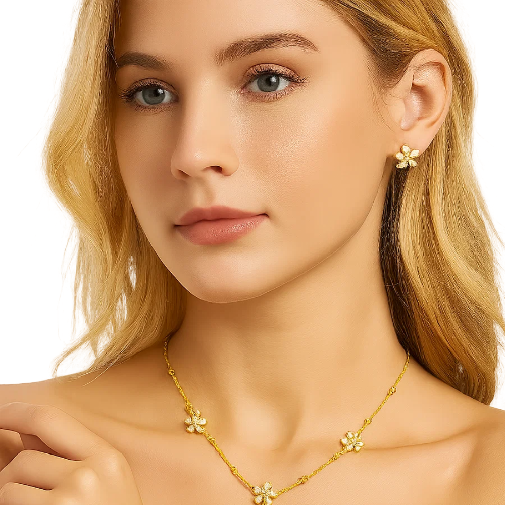 Gold-tone crystal blossom necklace with matching stud earrings, floral charms
