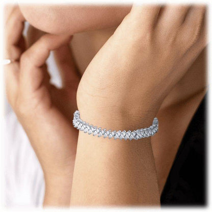 Cubic zirconia tennis bracelet on wrist, silver-tone marquise stone row