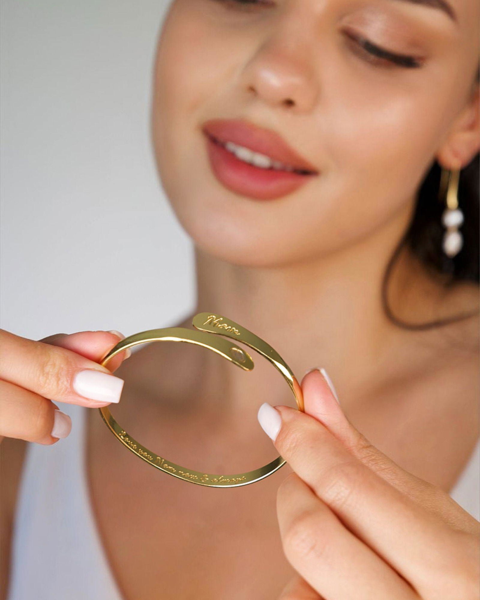 Gold-tone mom cuff bracelet, close-up of engraved script and wide bangle