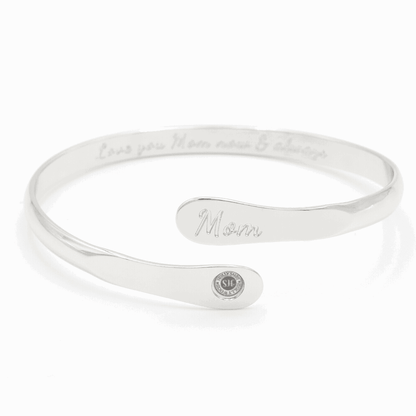 Silver-tone engraved mom cuff bracelet with oval charm and script “Mom”