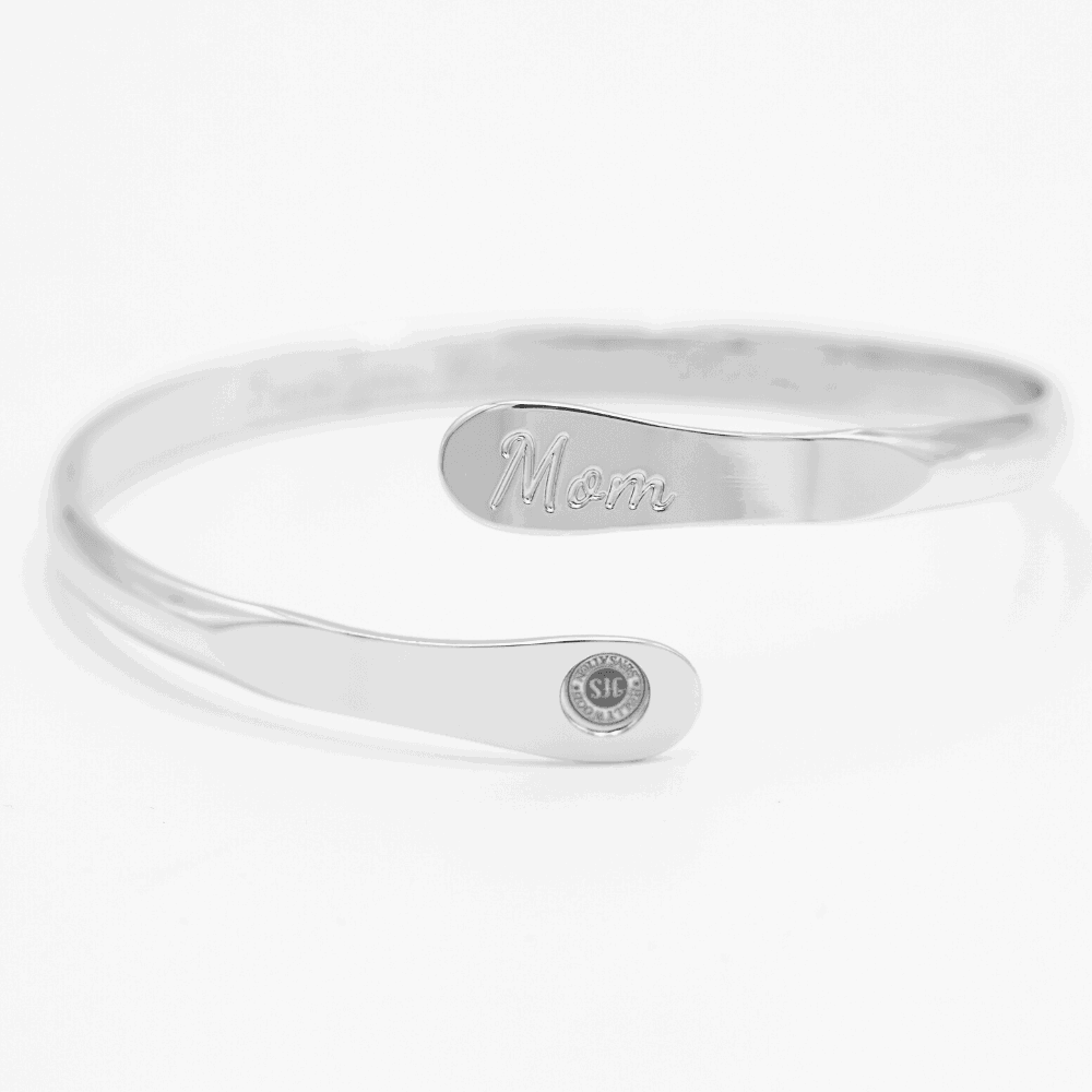 Silver mom bangle bracelet with engraved inner message and oval “Mom” medallion
