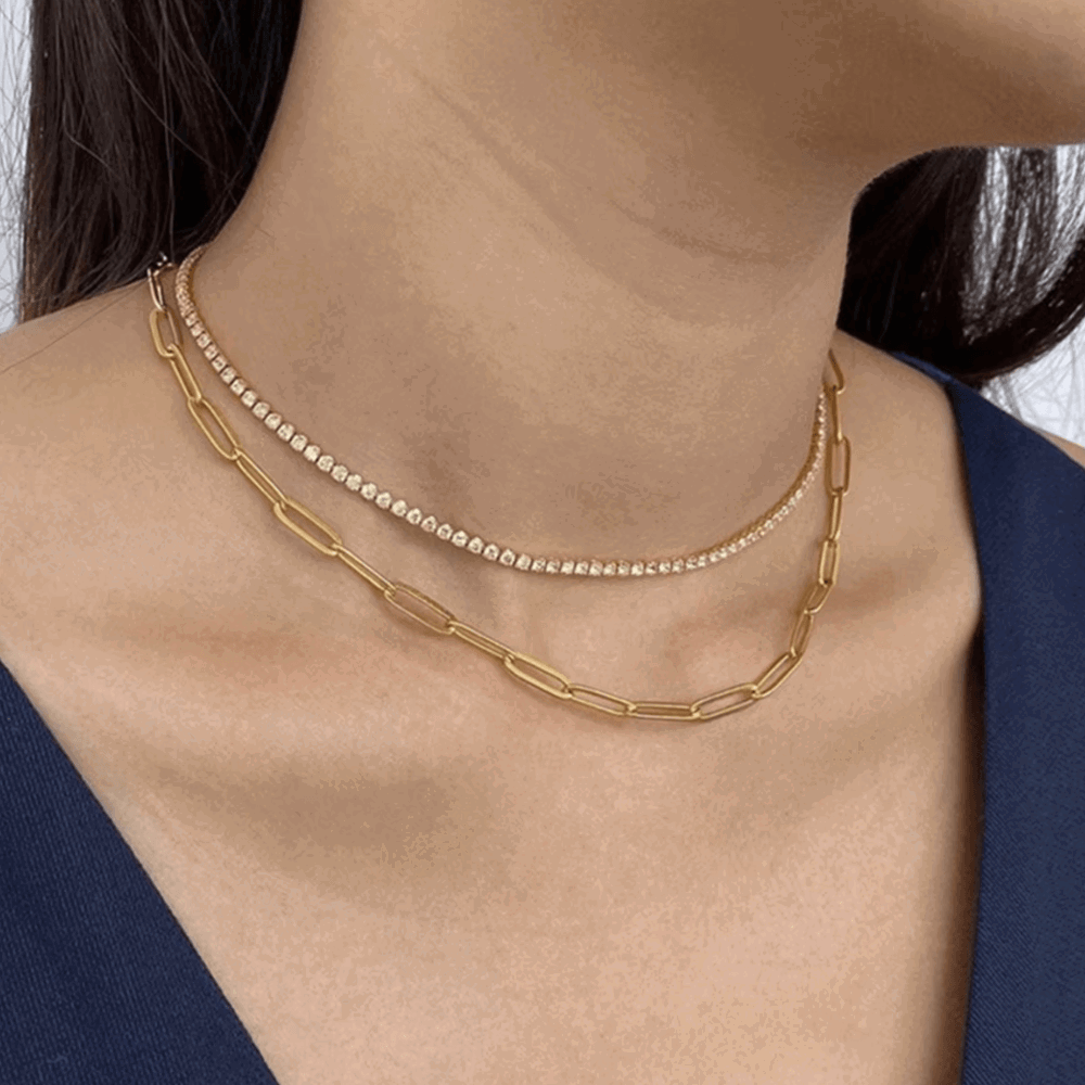 Gold-tone tennis necklace with round cubic zirconia stones along the center