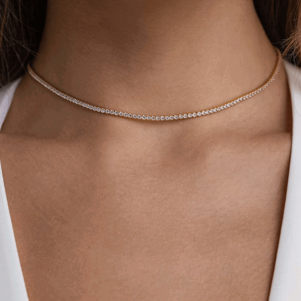 Silver-tone tennis necklace with a continuous row of round cubic zirconia