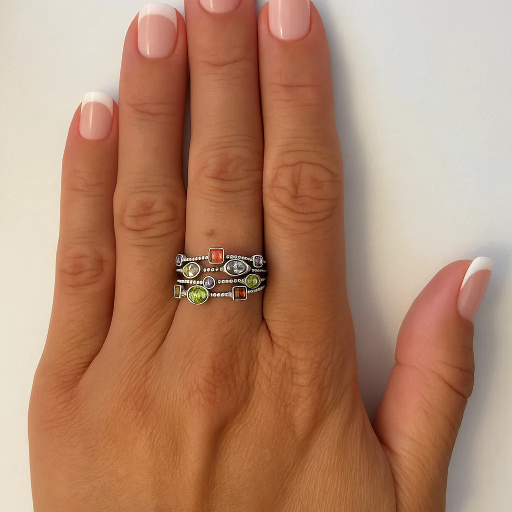 Silver-tone multicolor gemstone ring with red, green, and clear stones