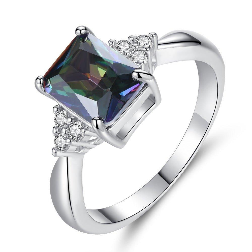 Silver ring with prong-set princess-cut multicolor gemstone and small diamond accents