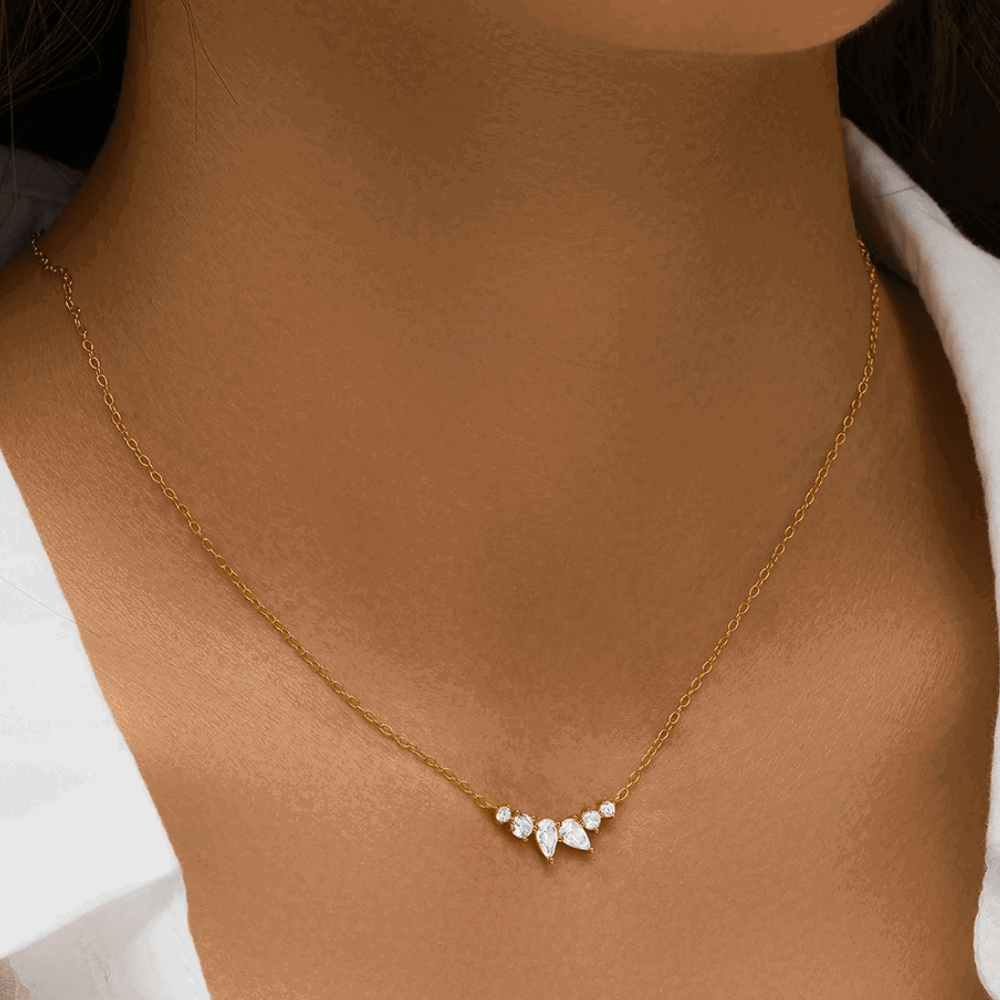 Gold-tone necklace with pear and round-cut cubic zirconia V-shaped cluster