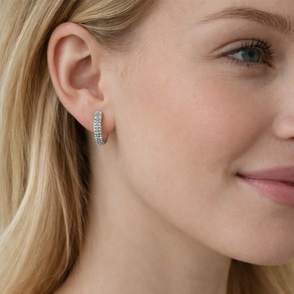 Nadia pavé huggie hoop earring in silver on ear