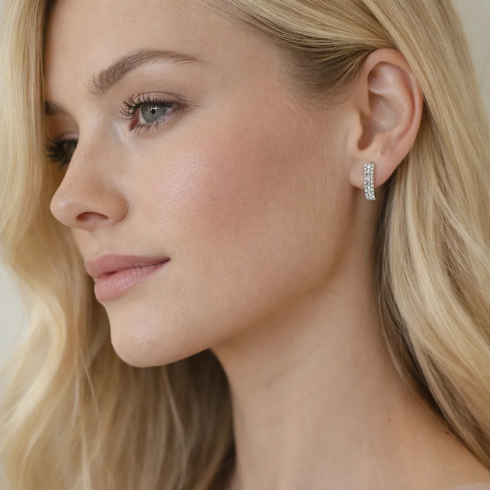 Nadia pavé huggie hoop earring on model's ear