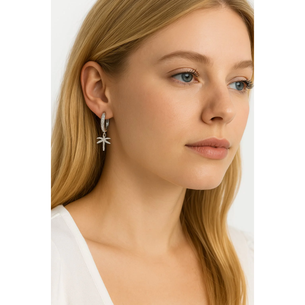 Silver hoop earrings with dangling palm tree charm, set with cubic zirconia