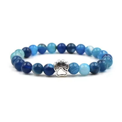 Blue gemstone-look bead charm bracelet with paw print metal centerpiece