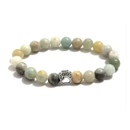 Pastel beaded bracelet with silver paw charm and round bead strands