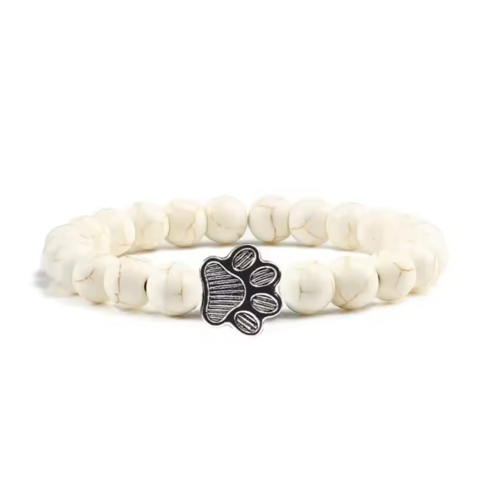 Snowy paw print charm bracelet with white beads and paw-shaped metal clasp