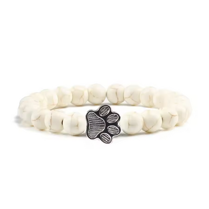 Snowy paw print charm bracelet with white beads and paw-shaped metal clasp