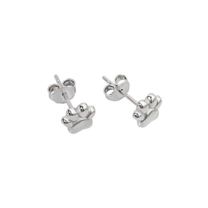 Silver mini paw print stud earrings, angled view of paw charms and studs