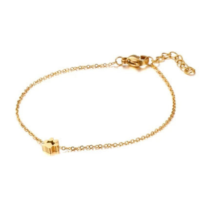 Gold-tone mini paw charm bracelet with adjustable chain and lobster clasp
