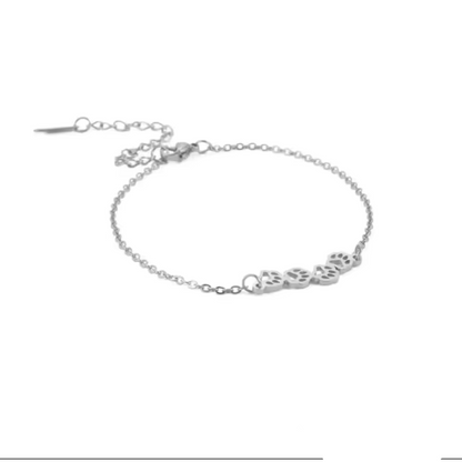 Silver paw-print link chain bracelet with small paw charms and lobster clasp