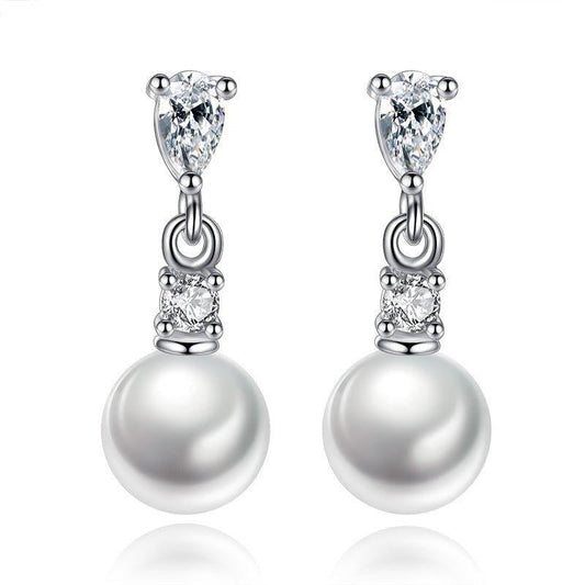 Silver-tone pearl drop earrings with cubic zirconia accents and dangling round pearl