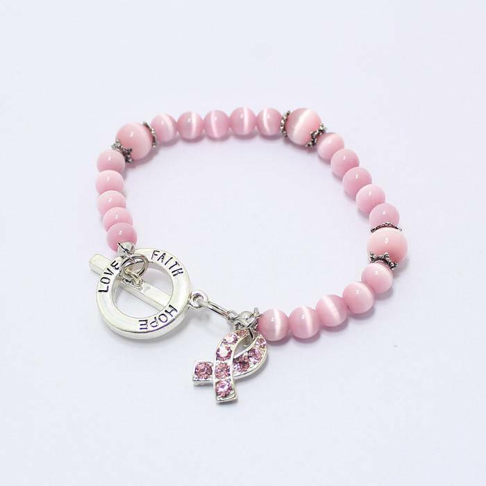 Pink beaded awareness bracelet with faith charms and rhinestone ribbon charm