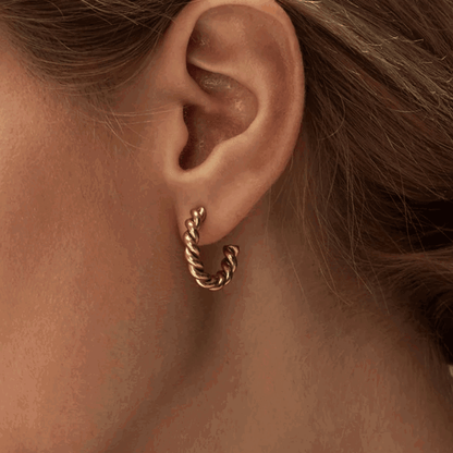 Gold twisted rope hoop earring with textured chain-like finish