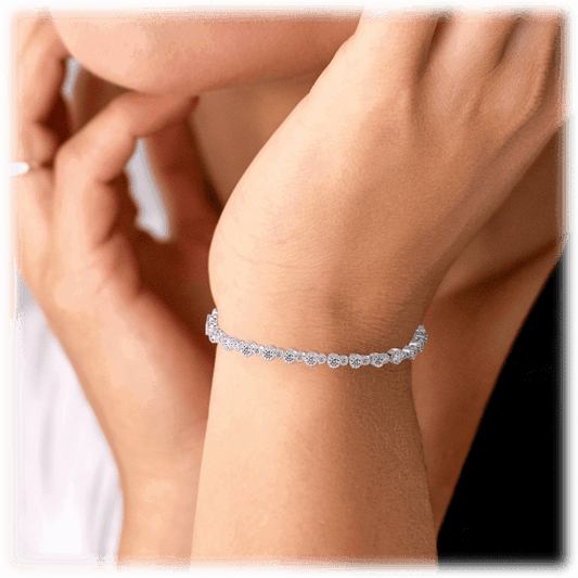 Silver round-cut cubic zirconia bracelet on wrist with small round sparkle stones