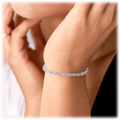 Cubic zirconia tennis bracelet worn on wrist, silver linked sparkle design