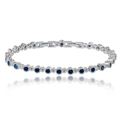 Blue and clear tennis bracelet with round cubic zirconia accents