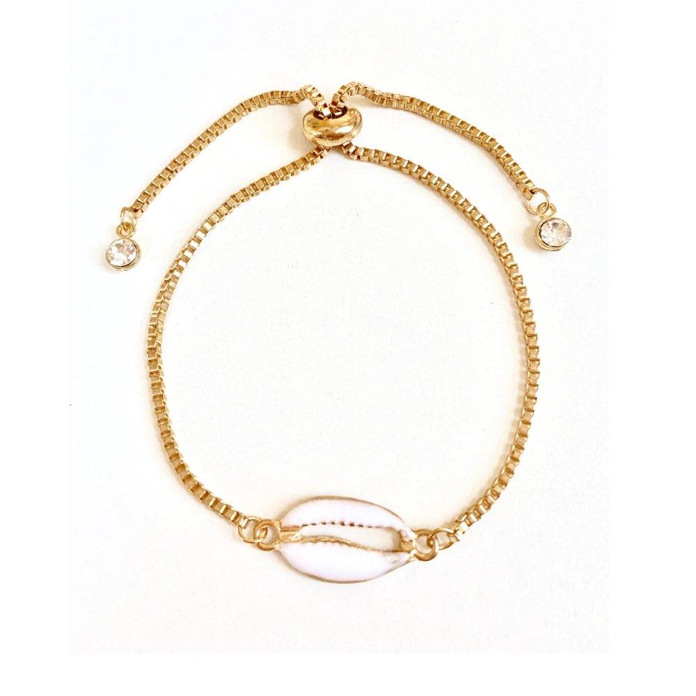 Gold seashell charm bracelet with adjustable spring clasp and small crystal beads.