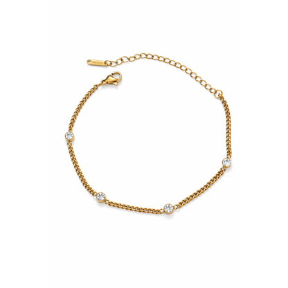 Gold bezel link bracelet with round clear stones and small toggle clasp