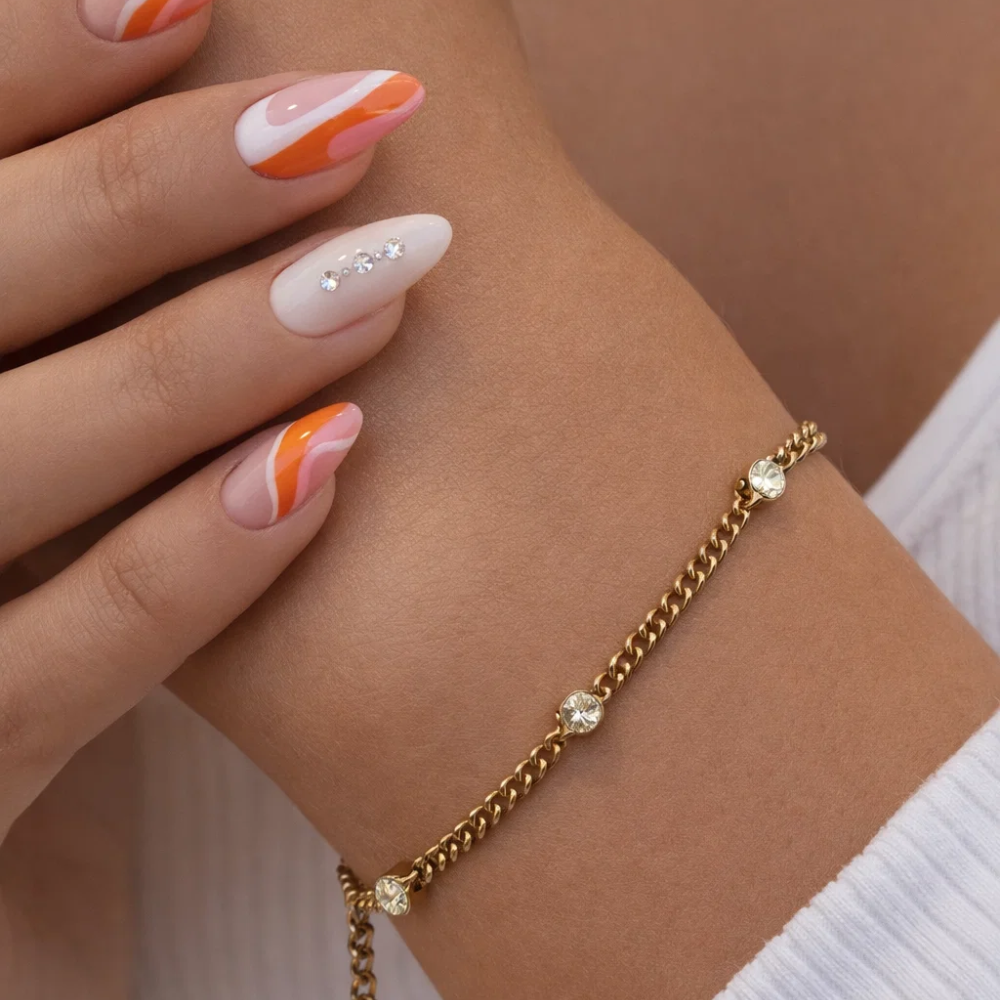 Gold bezel link bracelet with round clear stones on chunky chain links