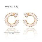 Gold shooting star hoop earrings; 17x17mm, white cubic zirconia stones