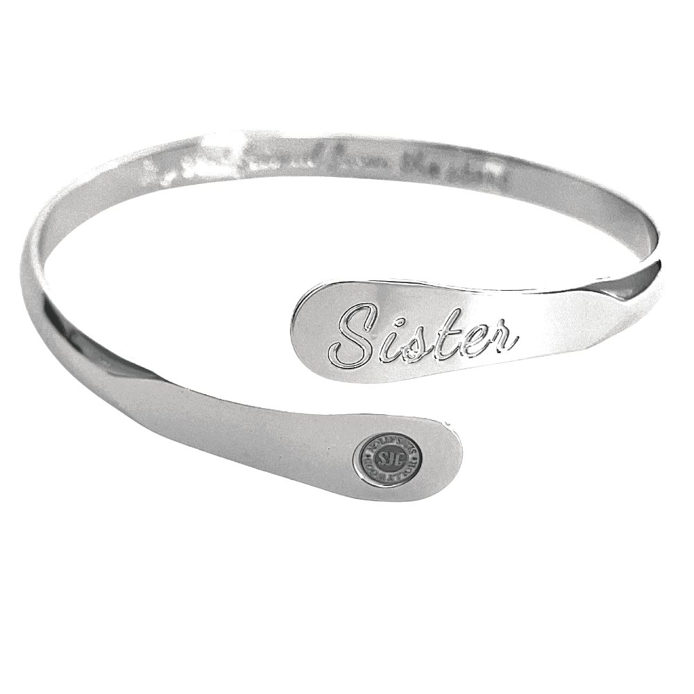 Silver sister bangle bracelet with engraved 'Sister' panel and round seal charm