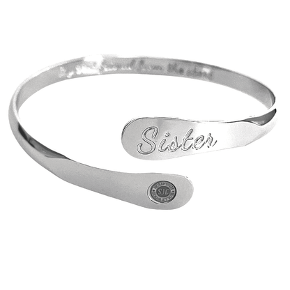 Silver sister bangle bracelet with engraved 'Sister' panel and round seal charm