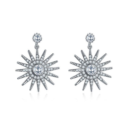 Starburst dangle earrings, silver-tone with white cubic zirconia center and spiked rays