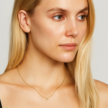 Gold-tone cable chain necklace with round cubic zirconia pendant on model