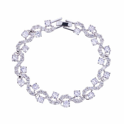 Round-cut cubic zirconia tennis bracelet in silver-tone, flexible oval link design.